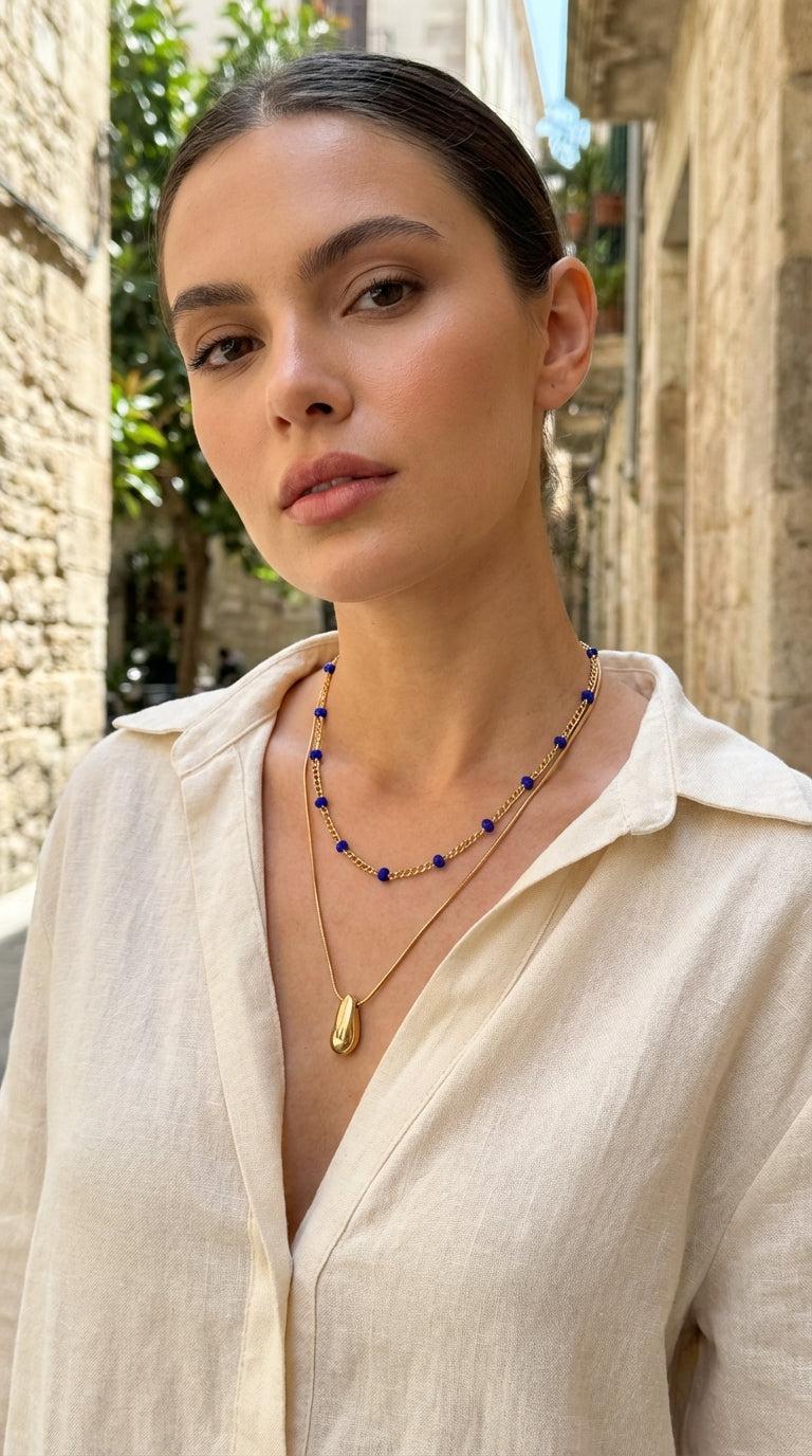 Short gold double layer necklace with blue crystals