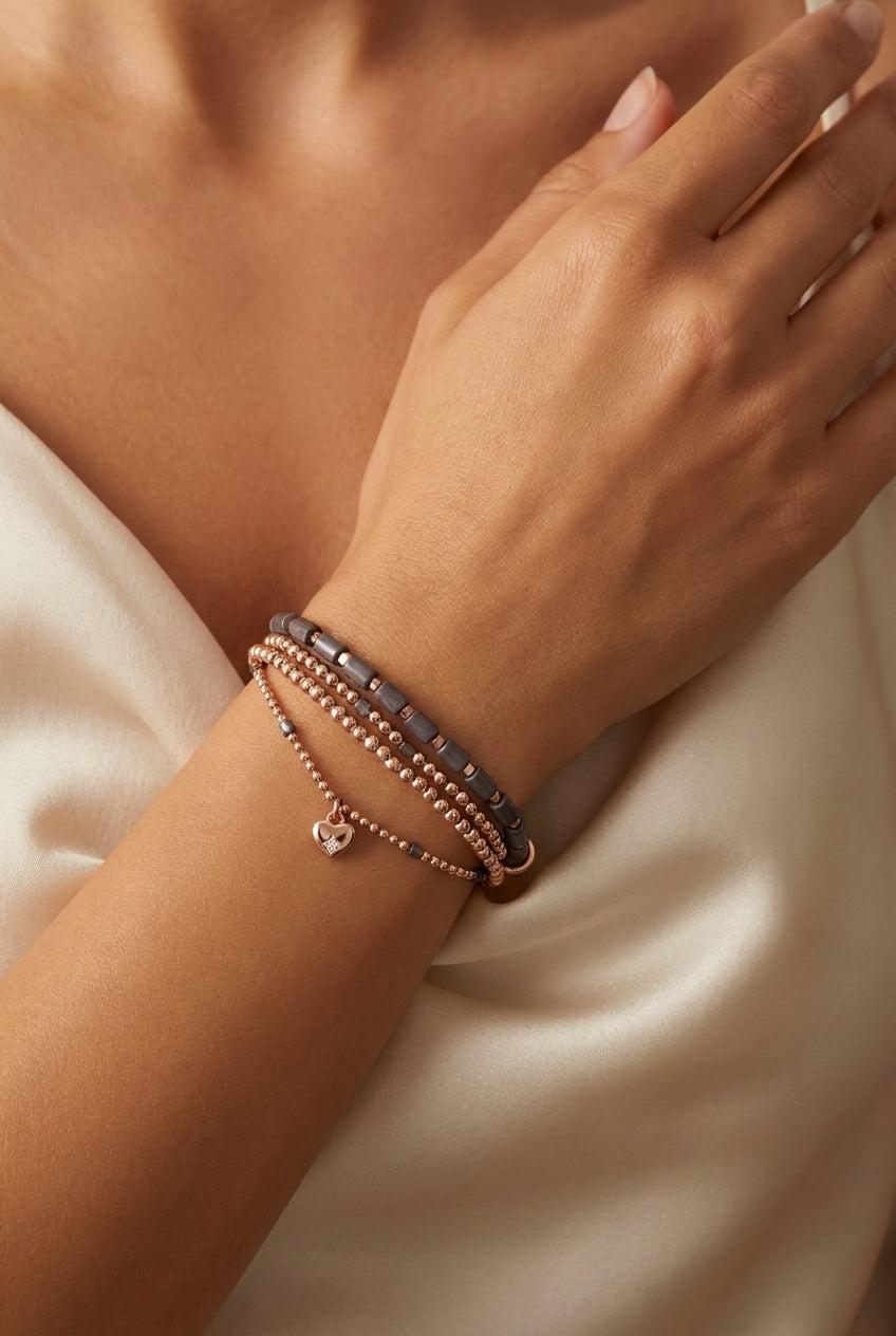 Gold and grey bead bracelet with heart charm